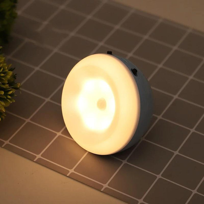 Puck night light lit on a worktop