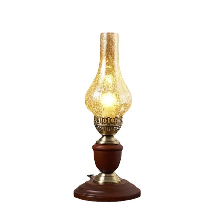 Vintage brass lamp with glass chimney, white background