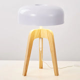 Light wood tripod lamp with white dome shade