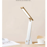 Portable LED desk lamp on a desk
