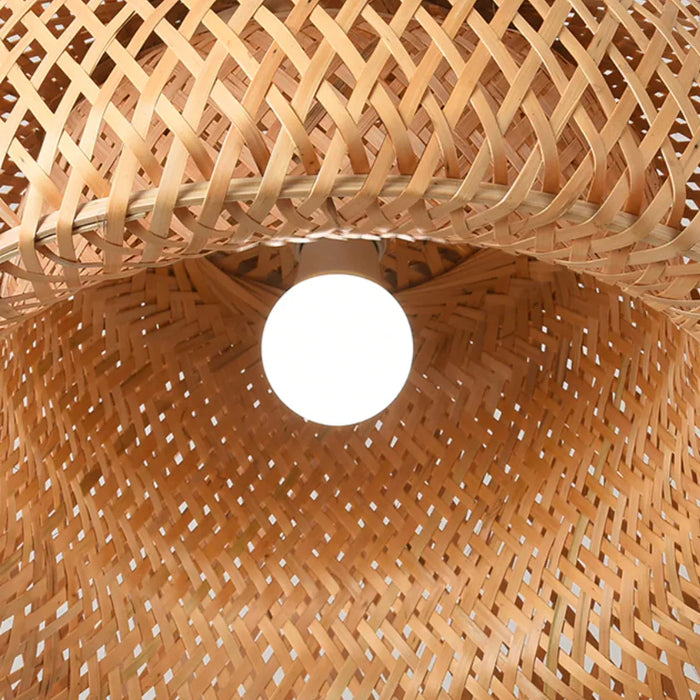 Inside the woven bamboo shade with the bulb lit