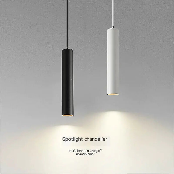 Black and white LED cylinder pendants hanging together