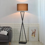 Drum shade standing lamp on a twisted metal base