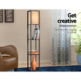 Three open display shelves under the fabric shade