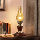 Brass chimney lamp on a bookshelf