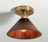 Walnut wood flush mount ceiling light, cone shade, lit