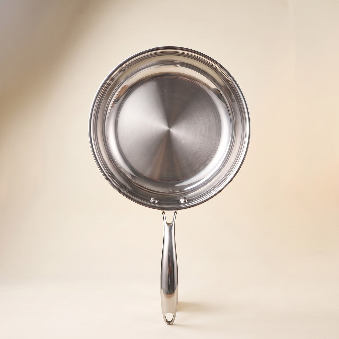 Stainless steel steak frying pan from directly above