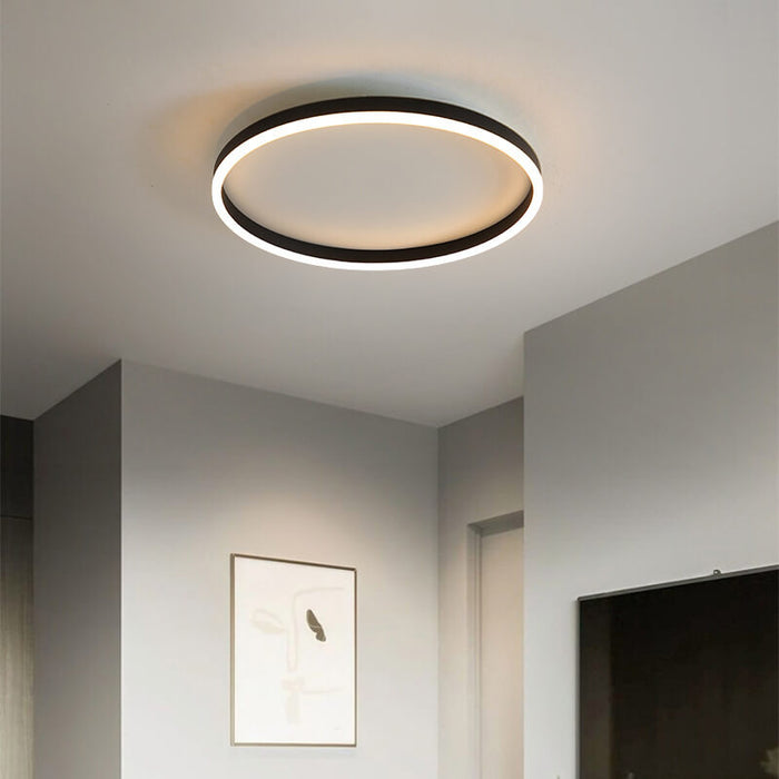 Ultra-thin ring ceiling light lit in a bedroom