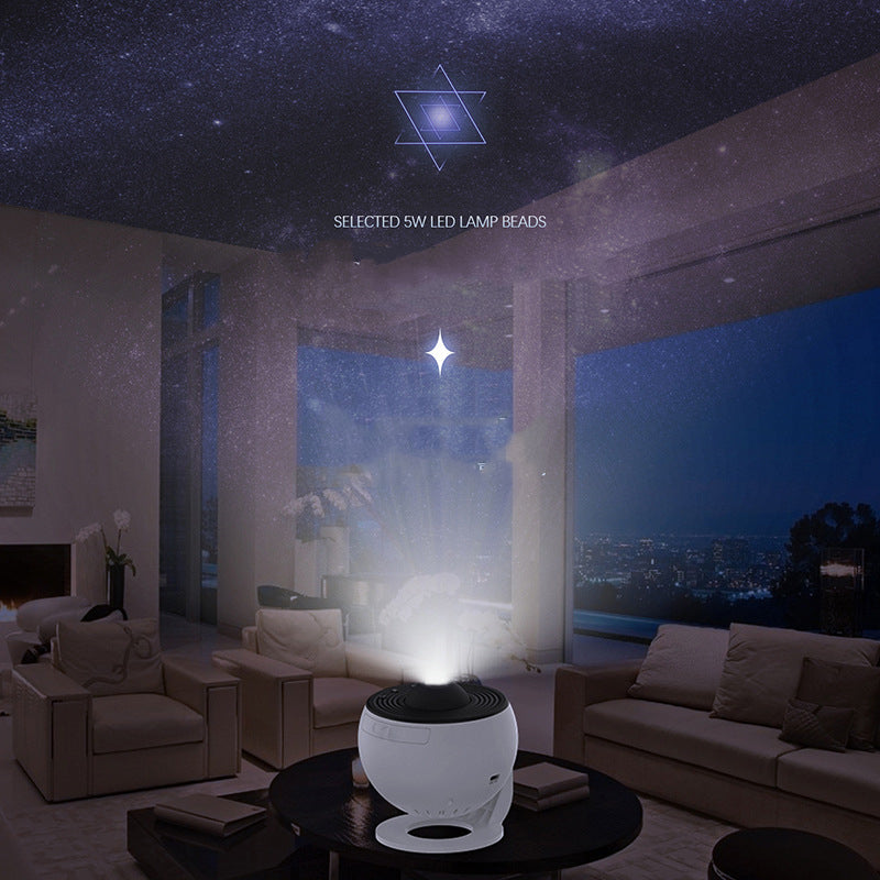 The projector on a living room side table throwing a starfield across the wall and ceiling