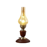 Vintage brass lamp with glass chimney, white background