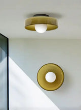 Brass and amber glass flush mount ceiling light