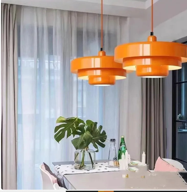 Orange macaron pendant lights over a living room