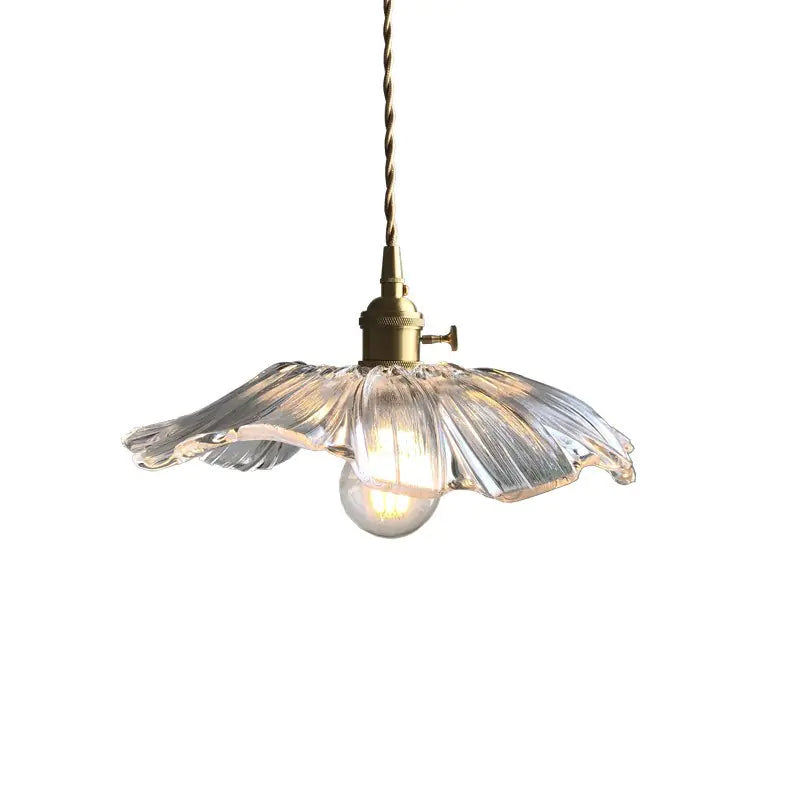 Brass and ribbed glass flower pendant light, white background