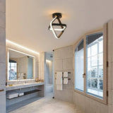 Black ring ceiling light above a bathroom vanity