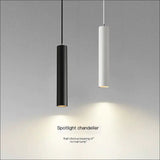 Black and white LED cylinder pendants hanging together