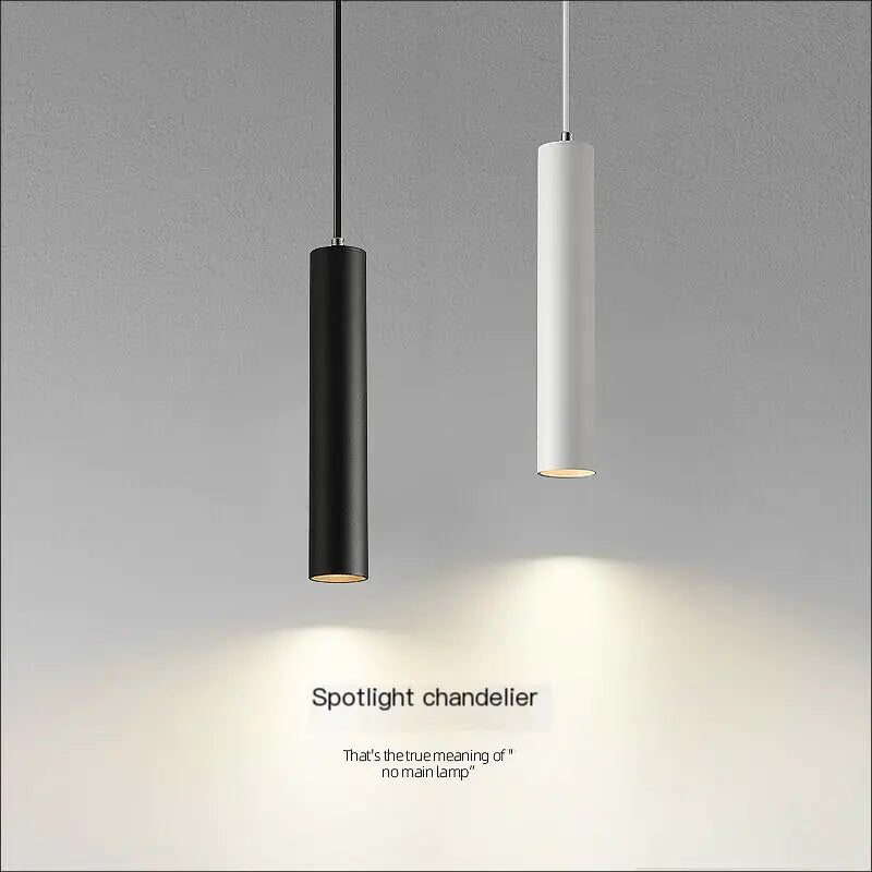 Black and white LED cylinder pendants hanging together