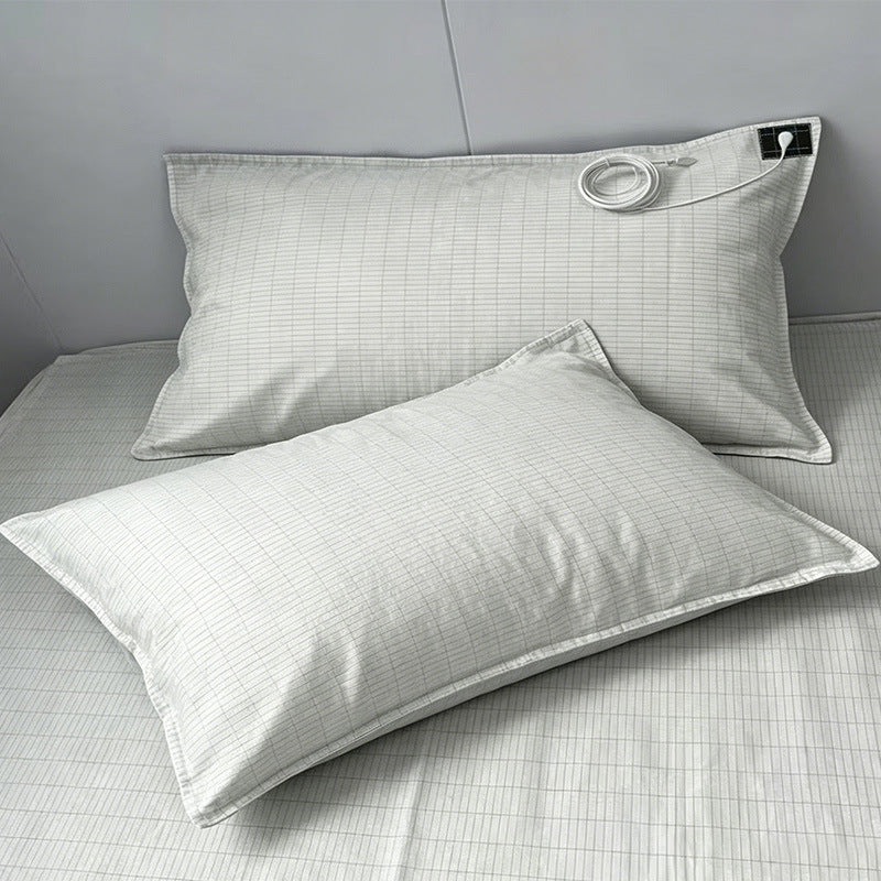 nostra-bed — two Nostra Grounding Pillowcases on a made bed