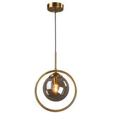 Glass globe pendant light in a brass ring, white background