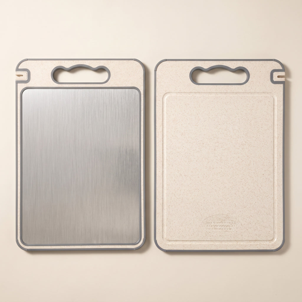 Both faces of the cutting board: brushed stainless steel and cream composite