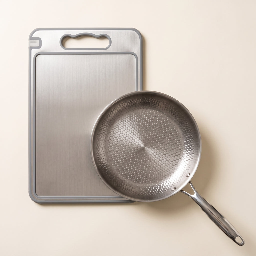 The stainless cutting board with the titanium frying pan