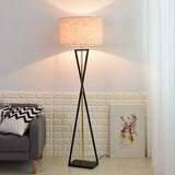 Drum shade floor lamp in a living room