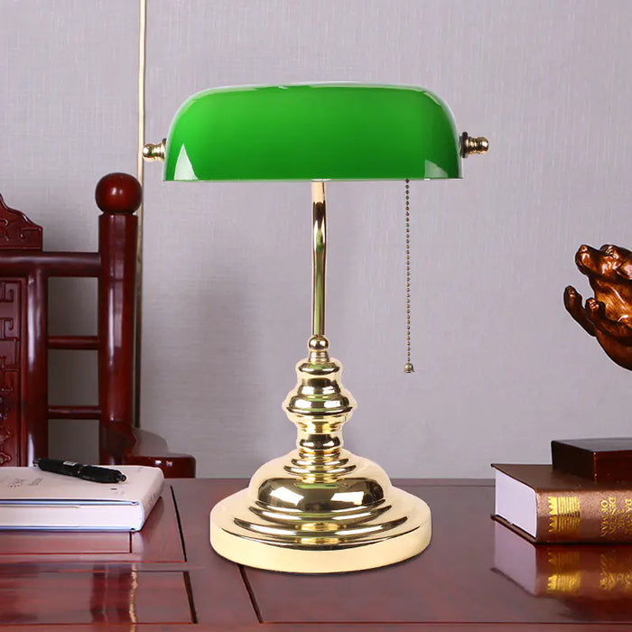 Banker's lamp on a wooden desk