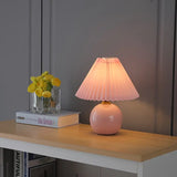 Pink mini ceramic lamp on a bedroom desk