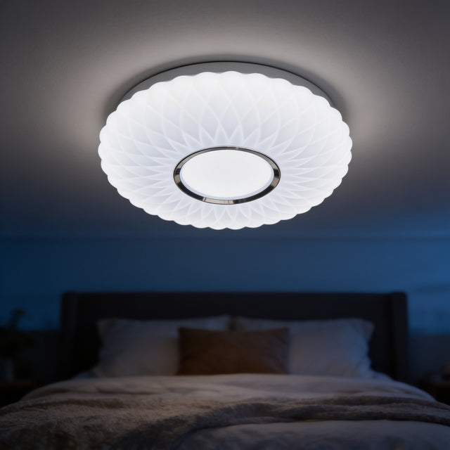 Fluted white dome LED ceiling light glowing above a bed
