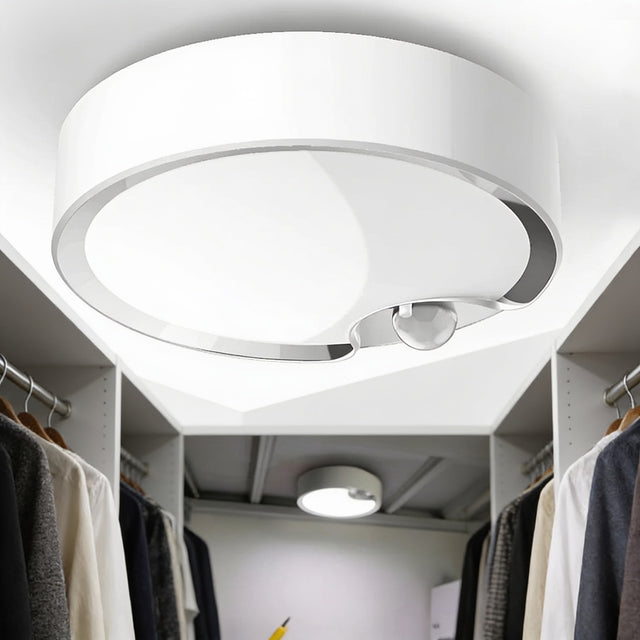 Motion sensor LED ceiling light lighting a walk-in wardrobe