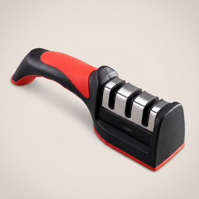 Handheld three-stage kitchen knife sharpener, black and red, studio packshot