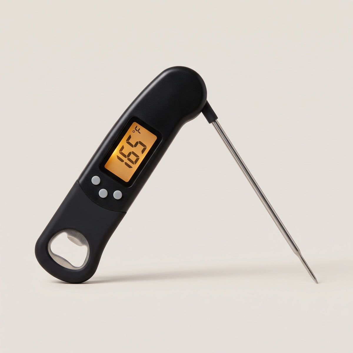 Digital food thermometer with the folding probe extended, amber display reading 165 degrees Fahrenheit