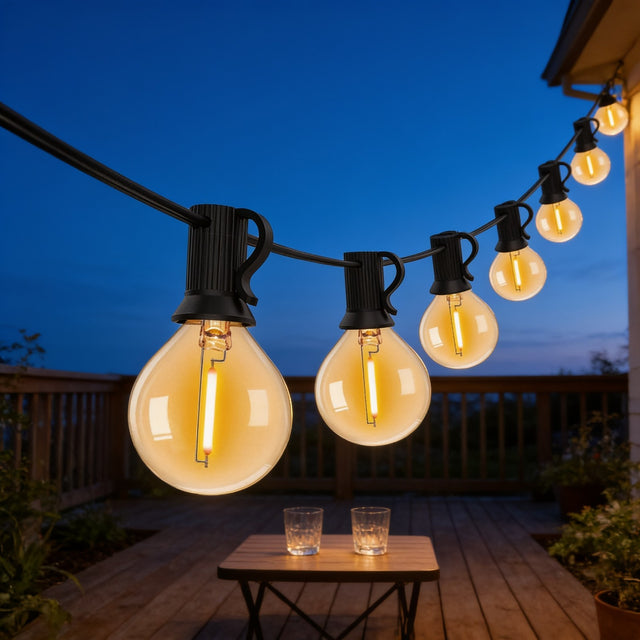 G40 globe outdoor string lights strung above a wooden deck patio at dusk