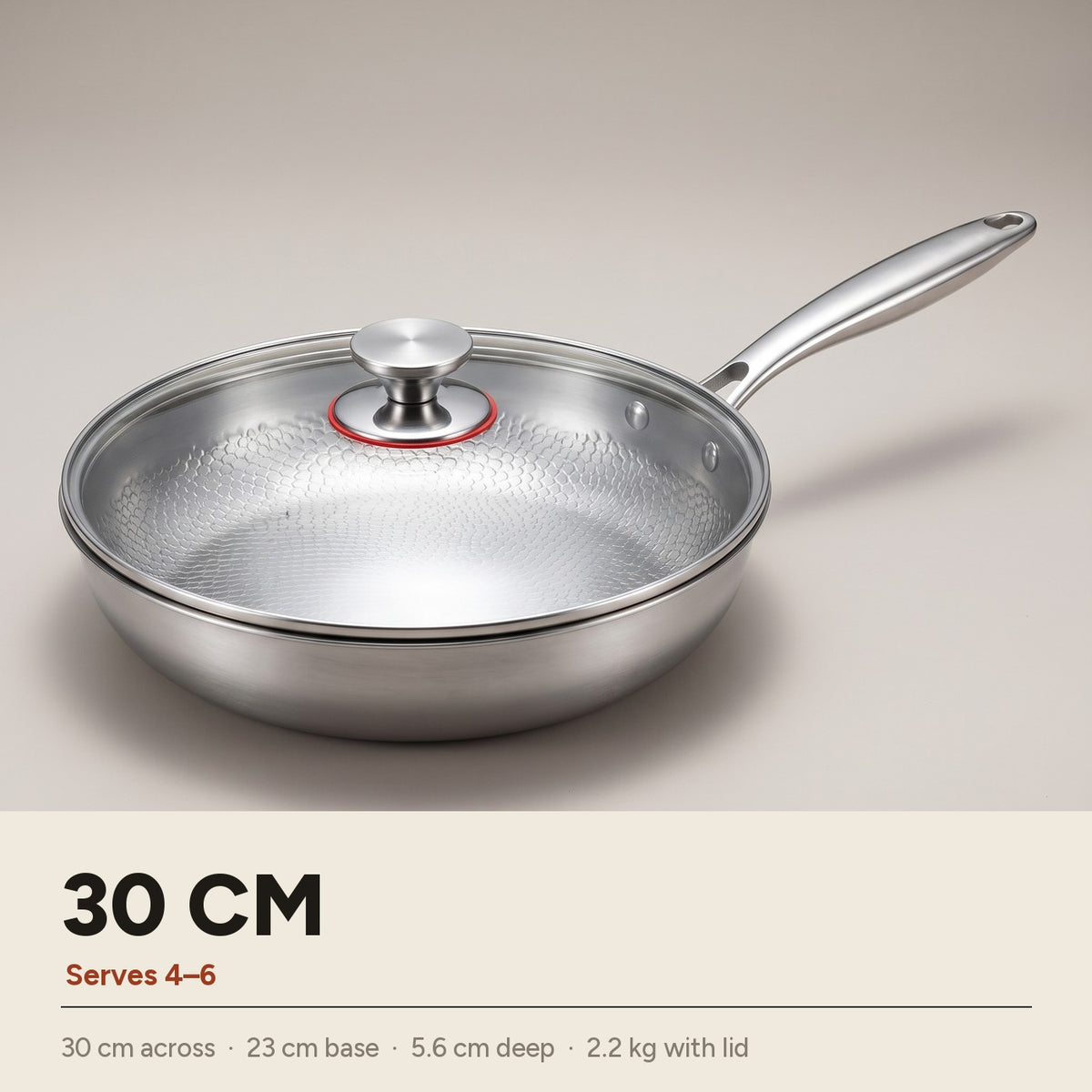 30cm titanium frying pan with glass lid — 30 cm across, 23 cm base, 5.6 cm deep, 2.2 kg with lid, serves 4 to 6