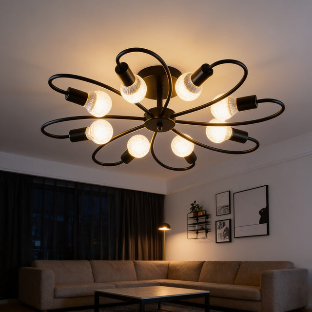 Black and gold sputnik flush mount ceiling light above a living room sofa