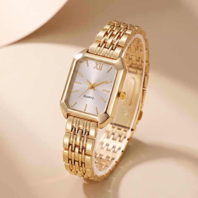 Pearl Dial Watch in gold with a pearlescent dial and woven link bracelet, studio shot