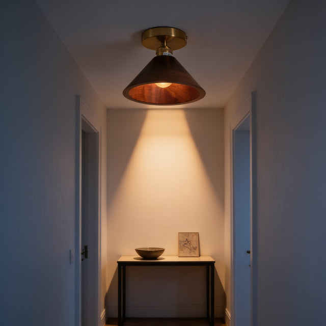 Walnut wood cone flush mount ceiling light above a hallway console table